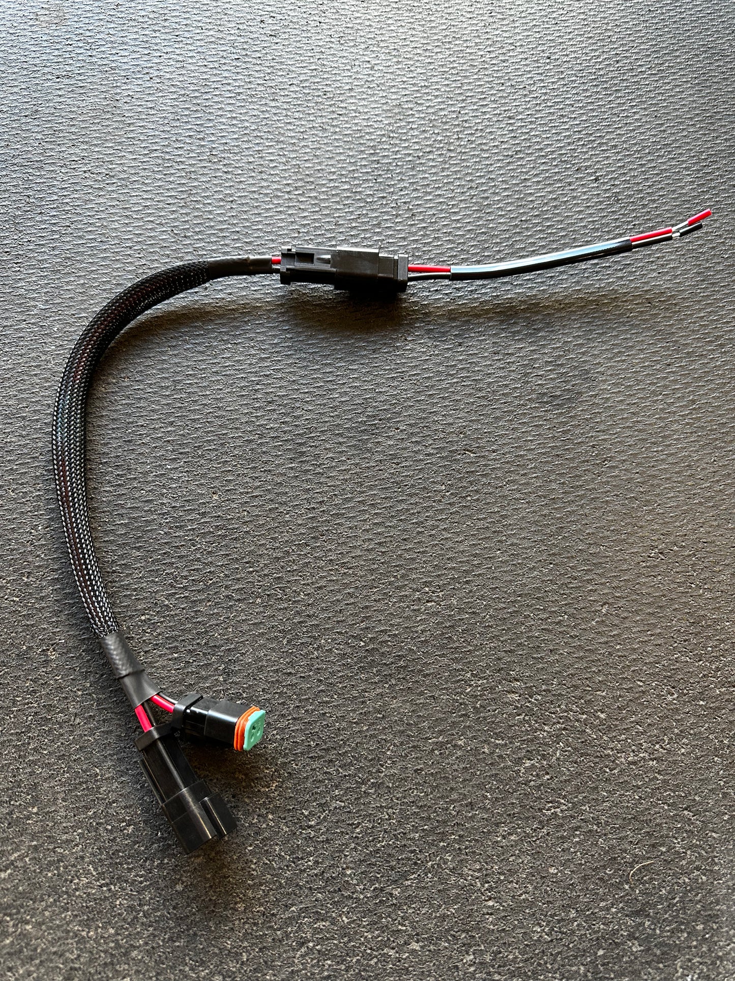 Caterpillar Plug & Play wiring harness extension.